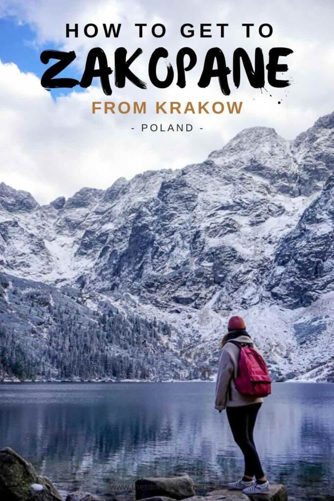 How to get to zakopane from Krakow. A travel guide featuring Amy standing in front of the snowy mountains and lake in Zakopane, Morskie Oko
