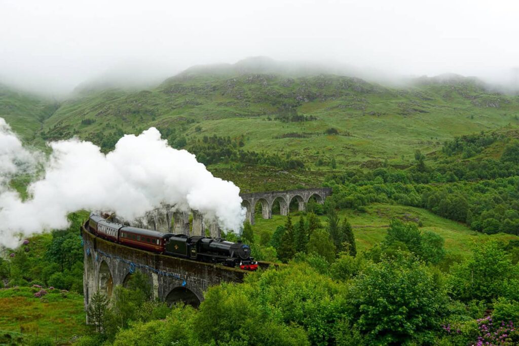 Jacobite steam train passing over Glenfinnan Viaduct
