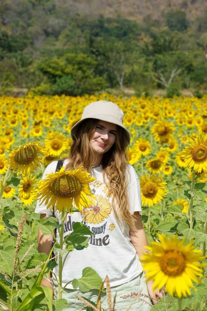 Amy nestled in the sunflowers
